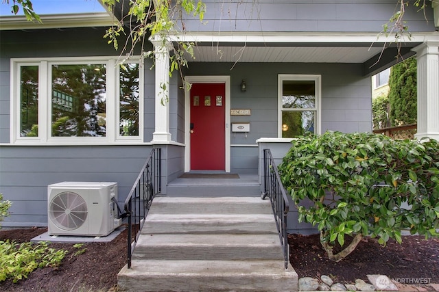 2433 E Valley St, Seattle, WA 98112 - view of exterior entry featuring a cooling unit and covered porch