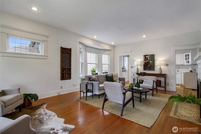 2433 E Valley St, Seattle, WA 98112 - living room featuring light wood-style floors, baseboards, and recessed lighting