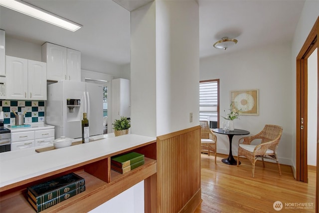 2433 E Valley St, Seattle, WA 98112 - kitchen with white appliances, white cabinetry, plenty of natural light, and light countertops