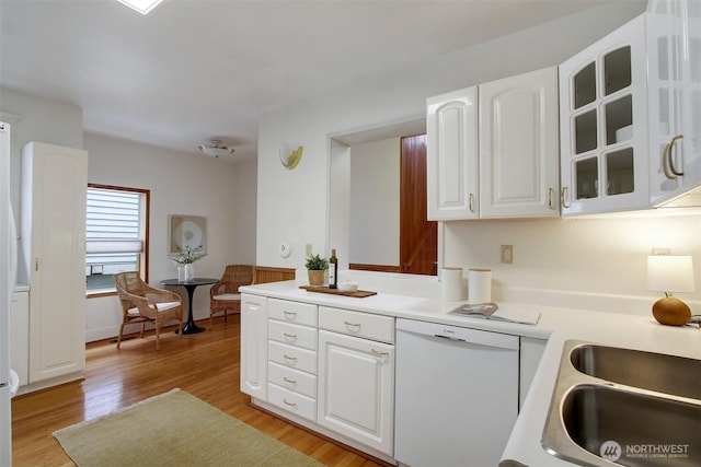 2433 E Valley St, Seattle, WA 98112 - kitchen featuring dishwasher, glass insert cabinets, white cabinets, light wood finished floors, and light countertops