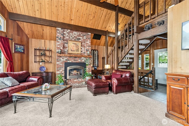 13911 Meridian Ave N, Marysville, WA 98271 - carpeted living room with wooden walls, wood ceiling with exposed beams, high vaulted ceiling, a fireplace, and stairway