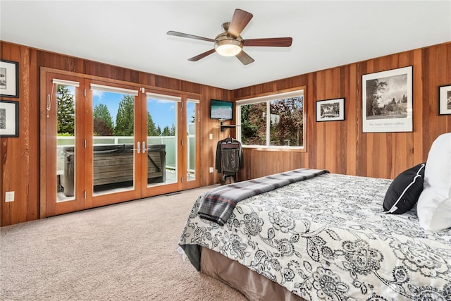 13911 Meridian Ave N, Marysville, WA 98271 - bedroom featuring carpet, multiple windows, access to exterior, wooden walls, and a ceiling fan
