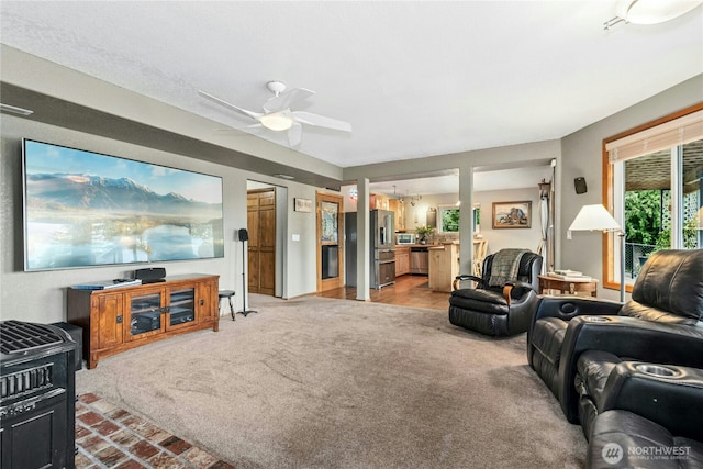 13911 Meridian Ave N, Marysville, WA 98271 - living room with light carpet and a ceiling fan
