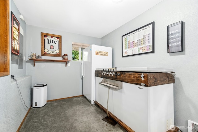 13911 Meridian Ave N, Marysville, WA 98271 - kitchen with freestanding refrigerator, carpet, and baseboards