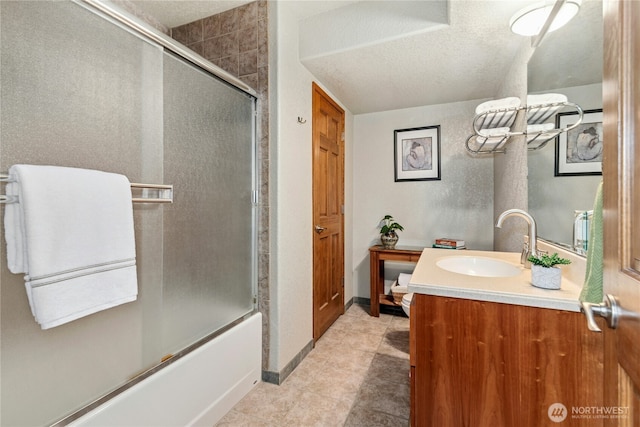 13911 Meridian Ave N, Marysville, WA 98271 - bathroom featuring vanity, bath / shower combo with glass door, tile patterned flooring, a textured ceiling, and baseboards
