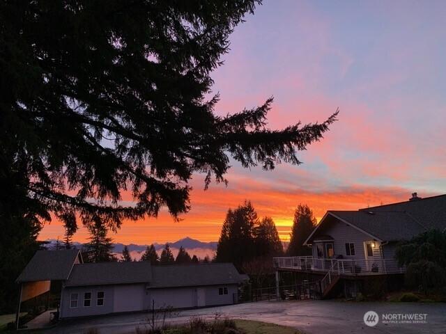 13911 Meridian Ave N, Marysville, WA 98271 - pool at dusk with a deck