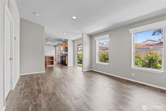 3516 Meadowbrook Ln SE, Lacey, WA 98503 - unfurnished living room with dark wood-style flooring, baseboards, and recessed lighting