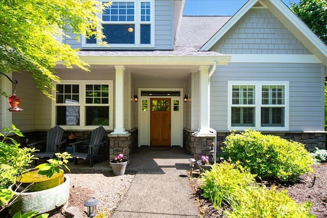 1259 Insel Rd, Woodland, WA 98674 - property entrance with covered porch, stone siding, and roof with shingles
