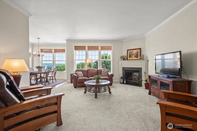 1259 Insel Rd, Woodland, WA 98674 - living room featuring ornamental molding, carpet, a fireplace with flush hearth, and a chandelier