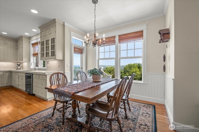 1259 Insel Rd, Woodland, WA 98674 - dining area with a chandelier, light wood-type flooring, wainscoting, crown molding, and recessed lighting