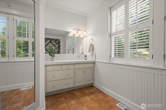 1259 Insel Rd, Woodland, WA 98674 - bathroom featuring healthy amount of natural light, vanity, ornamental molding, a wainscoted wall, and a chandelier