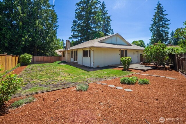 14210 NE 63rd Ct, Redmond, WA 98052 - back of house with a chimney and a patio