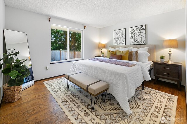 14210 NE 63rd Ct, Redmond, WA 98052 - bedroom with a textured ceiling and dark wood-type flooring