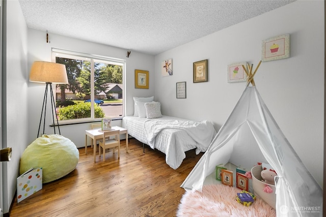 14210 NE 63rd Ct, Redmond, WA 98052 - bedroom featuring wood finished floors and a textured ceiling