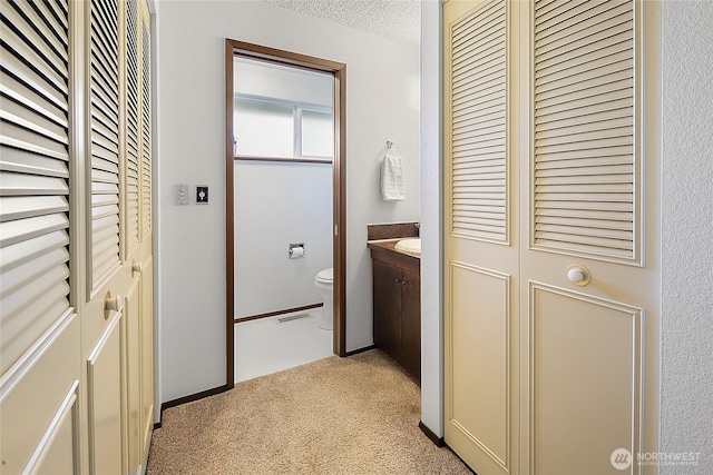 14210 NE 63rd Ct, Redmond, WA 98052 - corridor featuring light carpet and a textured ceiling