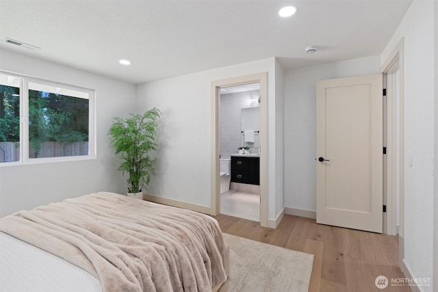 7118 177th St SW, Edmonds, WA 98026 - bedroom featuring light wood-style floors, recessed lighting, baseboards, and ensuite bath