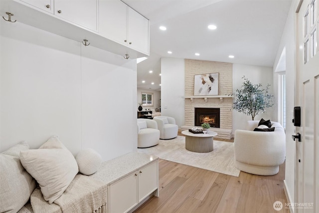 7118 177th St SW, Edmonds, WA 98026 - living room with light wood finished floors, recessed lighting, and a fireplace