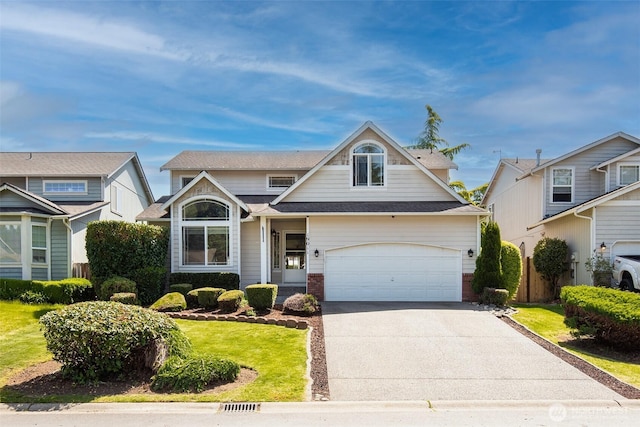 19011 89th Ave E, Puyallup, WA 98375 - view of front of property featuring brick siding, driveway, a front yard, and a shingled roof