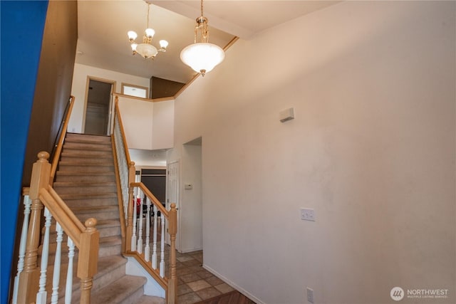 19011 89th Ave E, Puyallup, WA 98375 - stairway with beamed ceiling, baseboards, high vaulted ceiling, and a chandelier