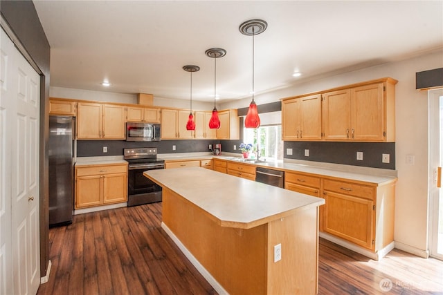 19011 89th Ave E, Puyallup, WA 98375 - kitchen featuring stainless steel appliances, light brown cabinets, light countertops, dark wood-style flooring, and a kitchen island