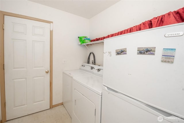 19011 89th Ave E, Puyallup, WA 98375 - laundry area featuring washer and dryer and baseboards