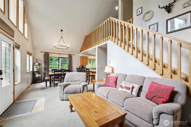 1051 Yellowstone, Snoqualmie Pass, WA 98068 - living room featuring high vaulted ceiling, a chandelier, light carpet, and stairway