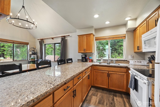 1051 Yellowstone, Snoqualmie Pass, WA 98068 - kitchen with white appliances, dark wood-style flooring, a sink, a chandelier, and brown cabinetry