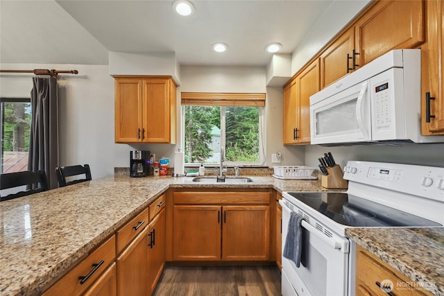 1051 Yellowstone, Snoqualmie Pass, WA 98068 - kitchen featuring white appliances, a sink, dark wood-style floors, light stone countertops, and brown cabinetry