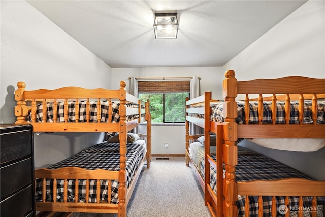 1051 Yellowstone, Snoqualmie Pass, WA 98068 - carpeted bedroom featuring lofted ceiling and baseboards
