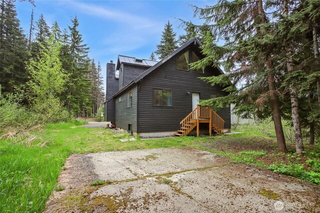 1051 Yellowstone, Snoqualmie Pass, WA 98068 - rear view of house with a chimney
