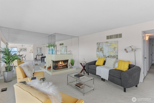 655 Main St Unit 304, Edmonds, WA 98020 - living area with carpet flooring and a multi sided fireplace