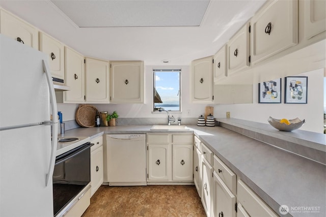 655 Main St Unit 304, Edmonds, WA 98020 - kitchen with white appliances, a sink, under cabinet range hood, and light countertops
