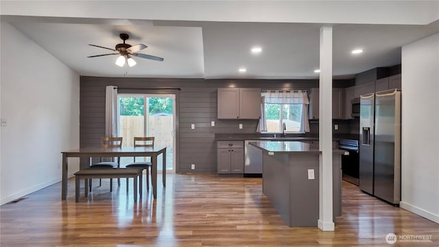 22470 Sunridge Way NE, Poulsbo, WA 98370 - kitchen featuring appliances with stainless steel finishes, light wood finished floors, ceiling fan, a kitchen island, and recessed lighting