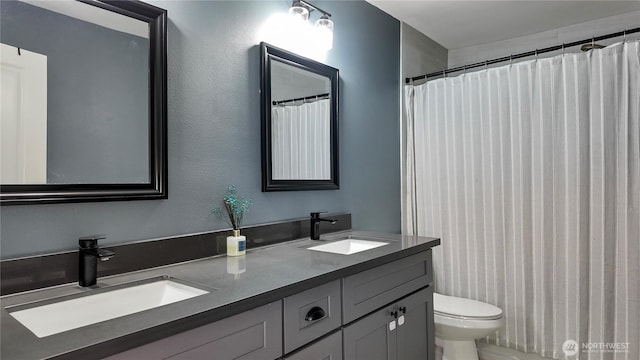 22470 Sunridge Way NE, Poulsbo, WA 98370 - bathroom featuring double vanity and toilet
