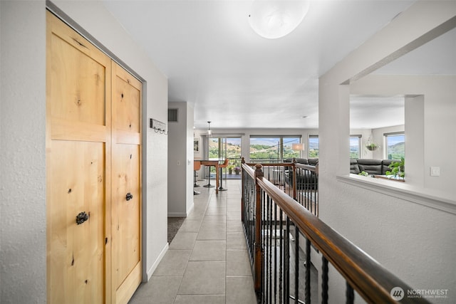 1901 Sleepy Hollow Rd, Wenatchee, WA 98801 - hall with an upstairs landing, light tile patterned floors, and baseboards
