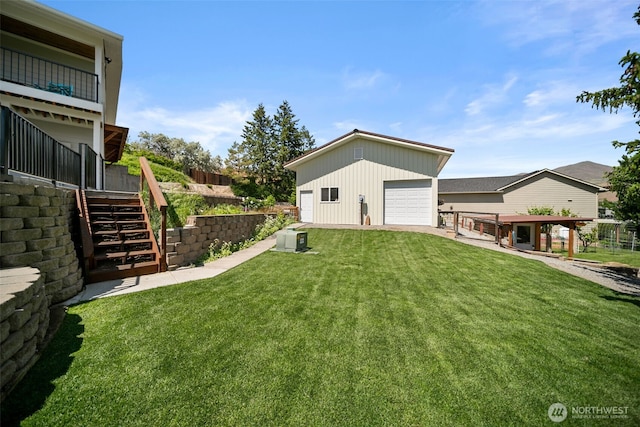 1901 Sleepy Hollow Rd, Wenatchee, WA 98801 - view of green lawn featuring stairs, a garage, and an outdoor structure