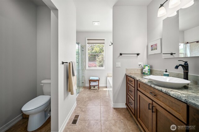 1901 Sleepy Hollow Rd, Wenatchee, WA 98801 - bathroom with vanity, toilet, a stall shower, and baseboards