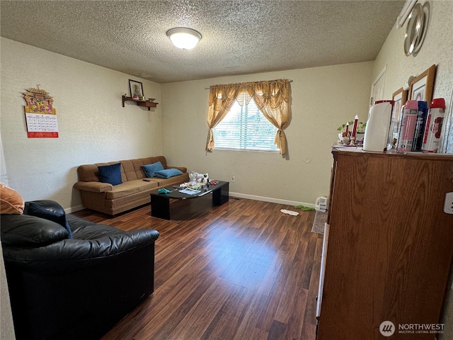 720 S 37th St, Tacoma, WA 98418 - living area featuring a textured ceiling, dark wood-style flooring, and baseboards