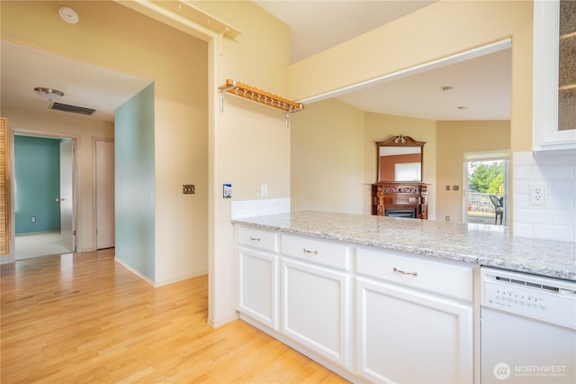 5419 N Court St, Ruston, WA 98407 - kitchen featuring white dishwasher, white cabinets, light wood-type flooring, and light stone countertops