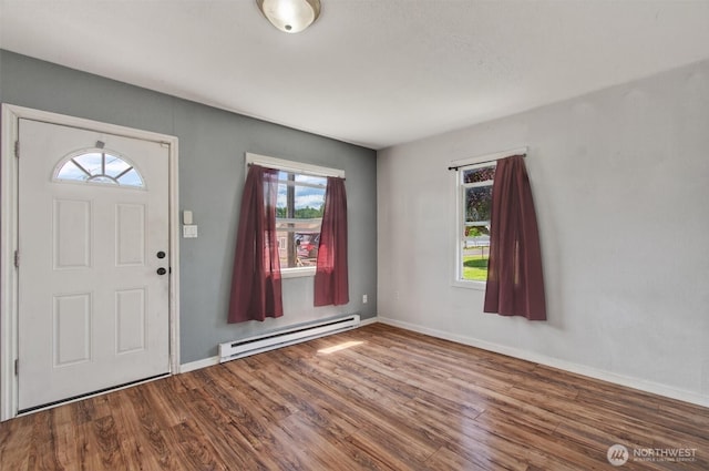 1412 N 4th Ave, Kelso, WA 98626 - foyer entrance with a baseboard heating unit, wood finished floors, and baseboards