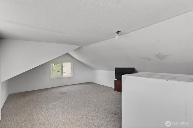 1412 N 4th Ave, Kelso, WA 98626 - bonus room with a textured ceiling, carpet flooring, and lofted ceiling