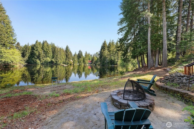 51 E Glamis Ct, Shelton, WA 98584 - view of patio / terrace featuring a fire pit, a water view, and a forest view