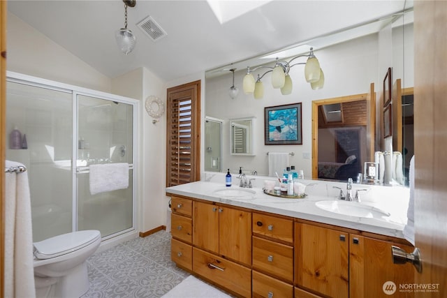 51 E Glamis Ct, Shelton, WA 98584 - ensuite bathroom featuring double vanity, a shower stall, lofted ceiling, and toilet