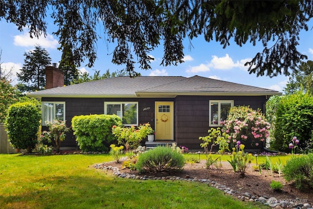 19027 37th Ave S, Seatac, WA 98188 - view of front of house featuring a chimney, a front lawn, and roof with shingles