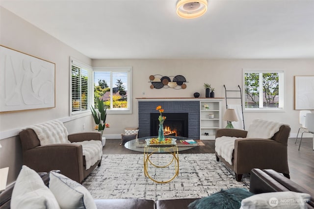 19027 37th Ave S, Seatac, WA 98188 - living room with wood finished floors, plenty of natural light, and a brick fireplace