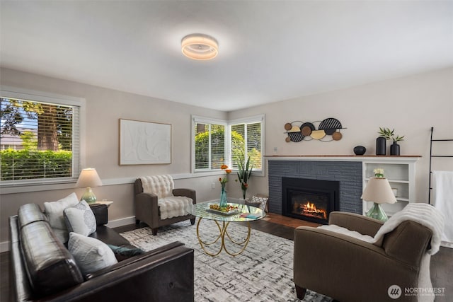 19027 37th Ave S, Seatac, WA 98188 - living area featuring wood finished floors, a fireplace, and baseboards