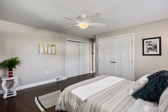 19027 37th Ave S, Seatac, WA 98188 - bedroom with baseboards, wood finished floors, a ceiling fan, and multiple closets
