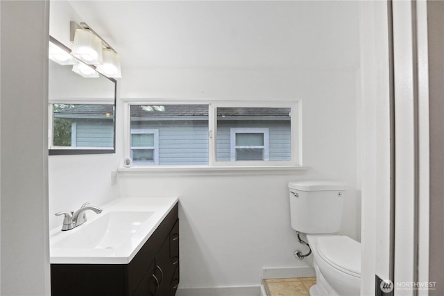 45885 Division St, Concrete, WA 98237 - bathroom featuring vanity, toilet, and baseboards