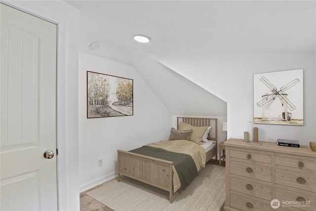45885 Division St, Concrete, WA 98237 - bedroom with vaulted ceiling, baseboards, and light carpet
