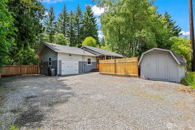 140 Tremont St, Port Orchard, WA 98366 - garage with a storage unit and gravel driveway